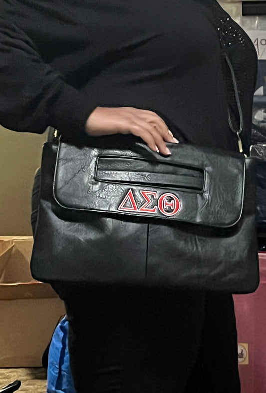 Delta Clutch Bag